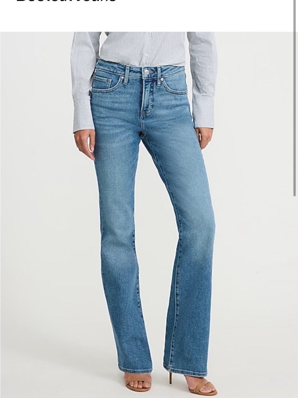 Mid rise medium wash bootcut jeans